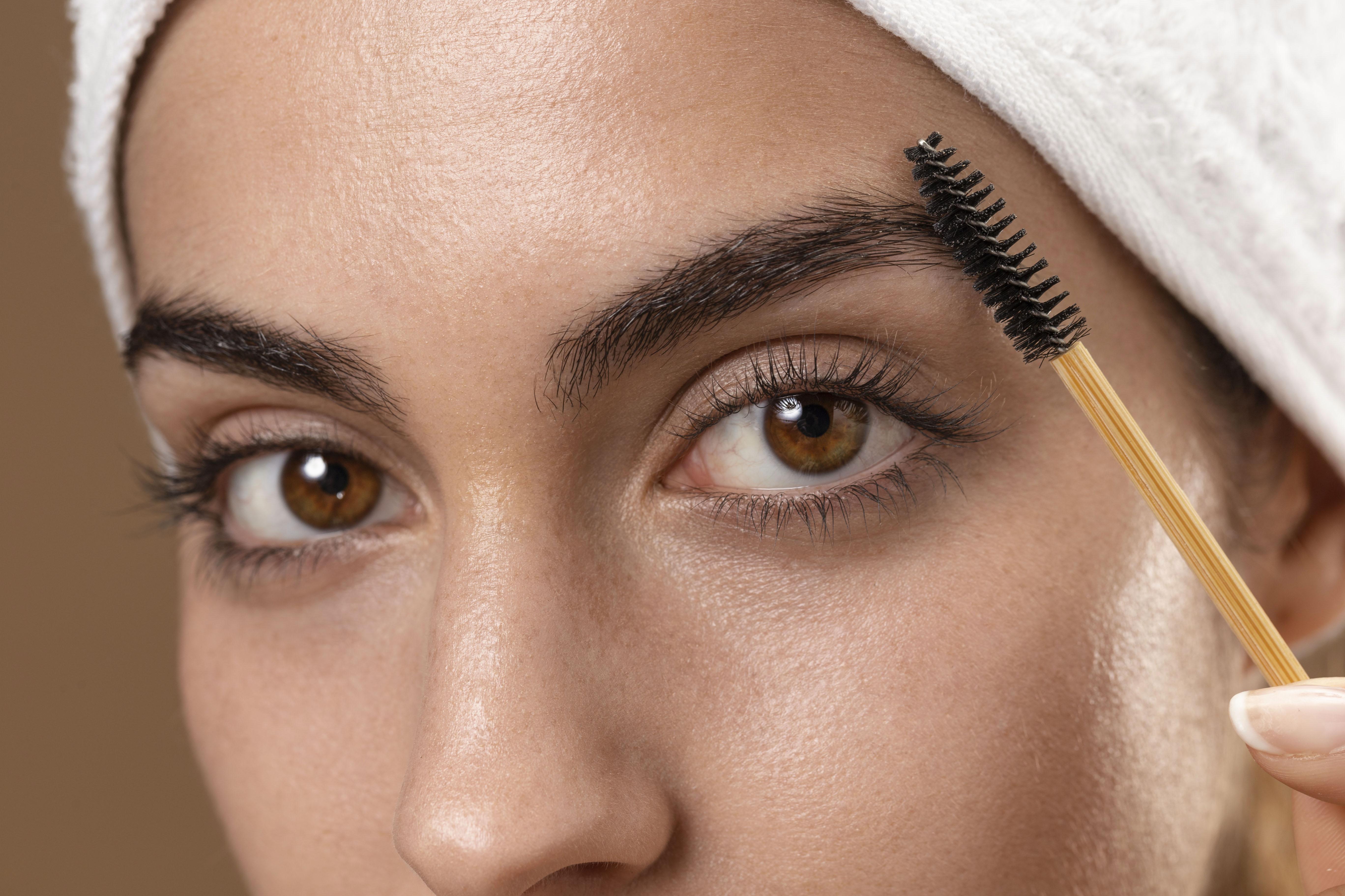 young-woman-taking-care-of-her-eyebrows